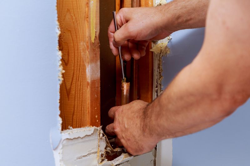 Plumber Performing Leak Repair